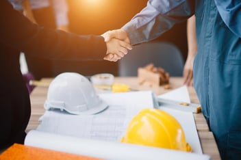 Businessman and engineer handshake closing a deal in construction site. Sucessful,engineering and business concept.