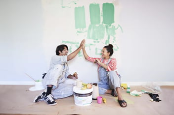 Couple taking break while renovating home