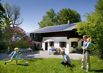 Family at home with solar panel