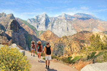 Family on vacation hiking in the mountains.