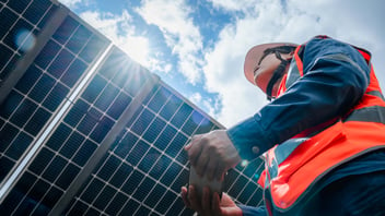 Low angle view of solar farm(solar panel) with engineers check the operation of the system, Alternative energy to conserve the world's energy, Photovoltaic module idea for clean energy production