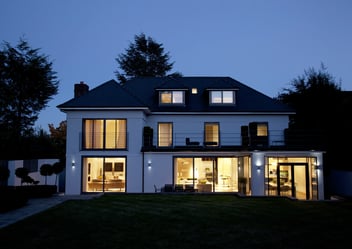 Modern house illuminated at night