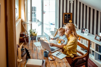 Young mother working from home