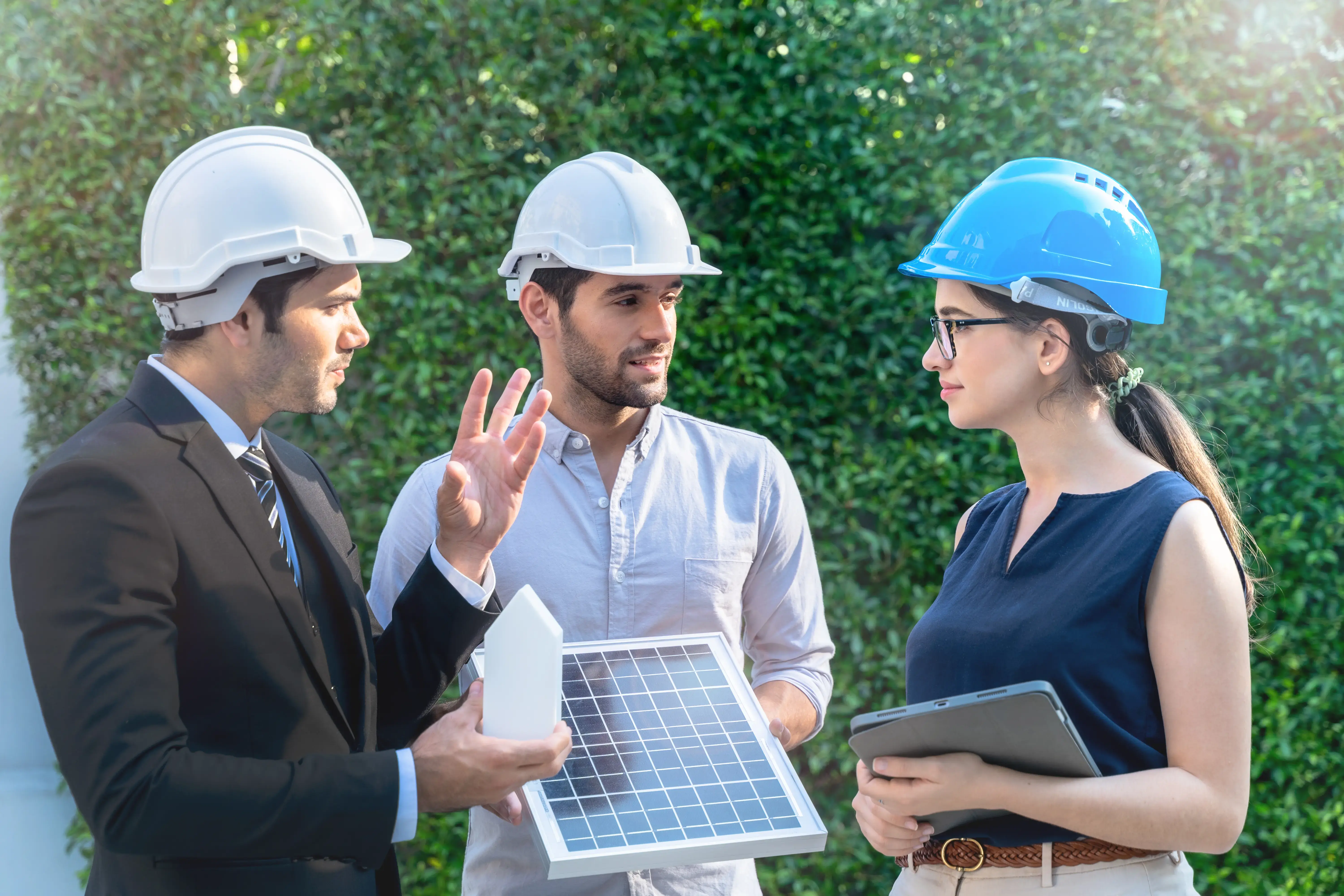 Business Engineers Meeting Innovative More Efficient Solar Panel Battery Concept of Renewable Energy Working. Specialists Gathered for Outdoor testing Photovoltaic cells module.