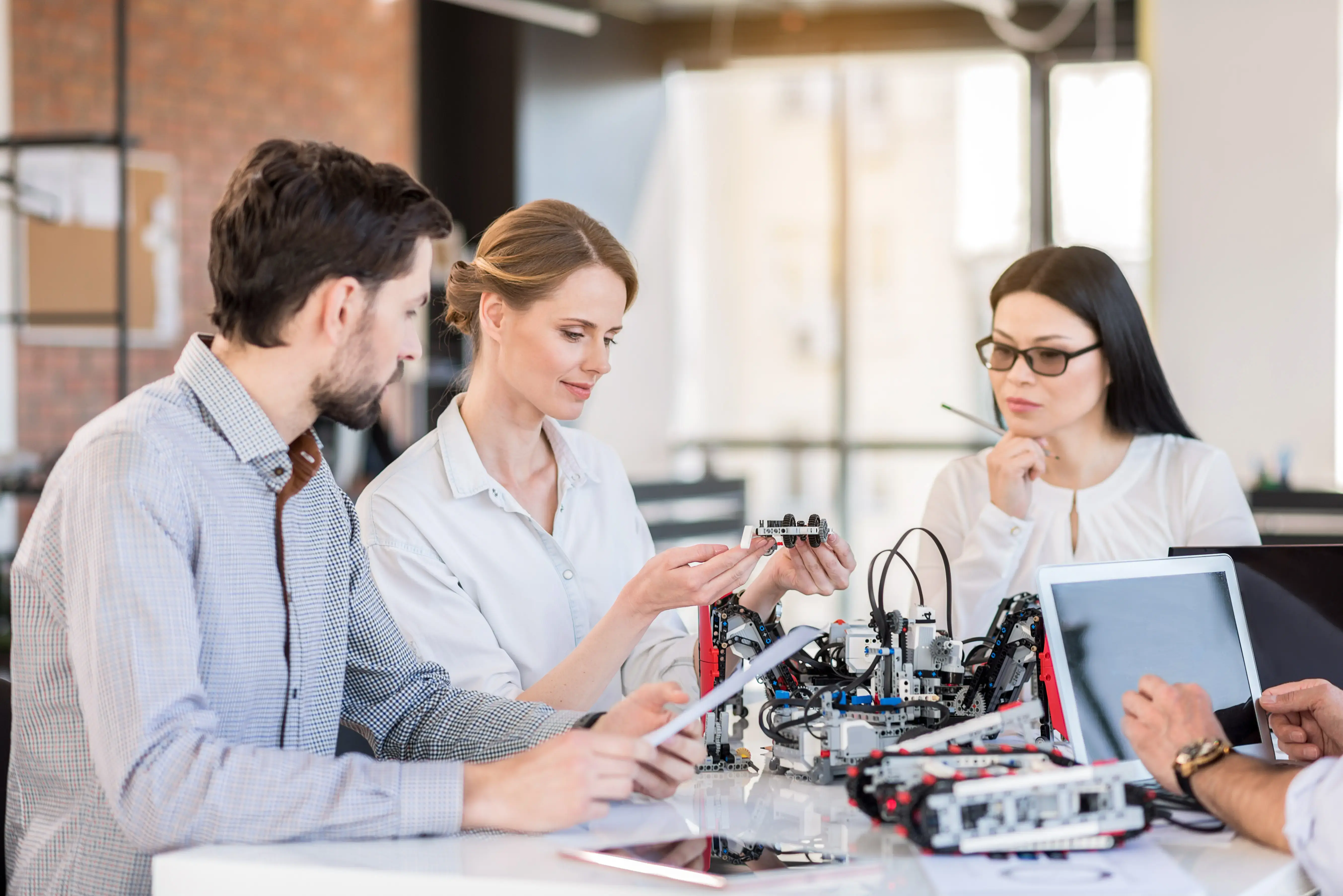 Professional team testing new device in office