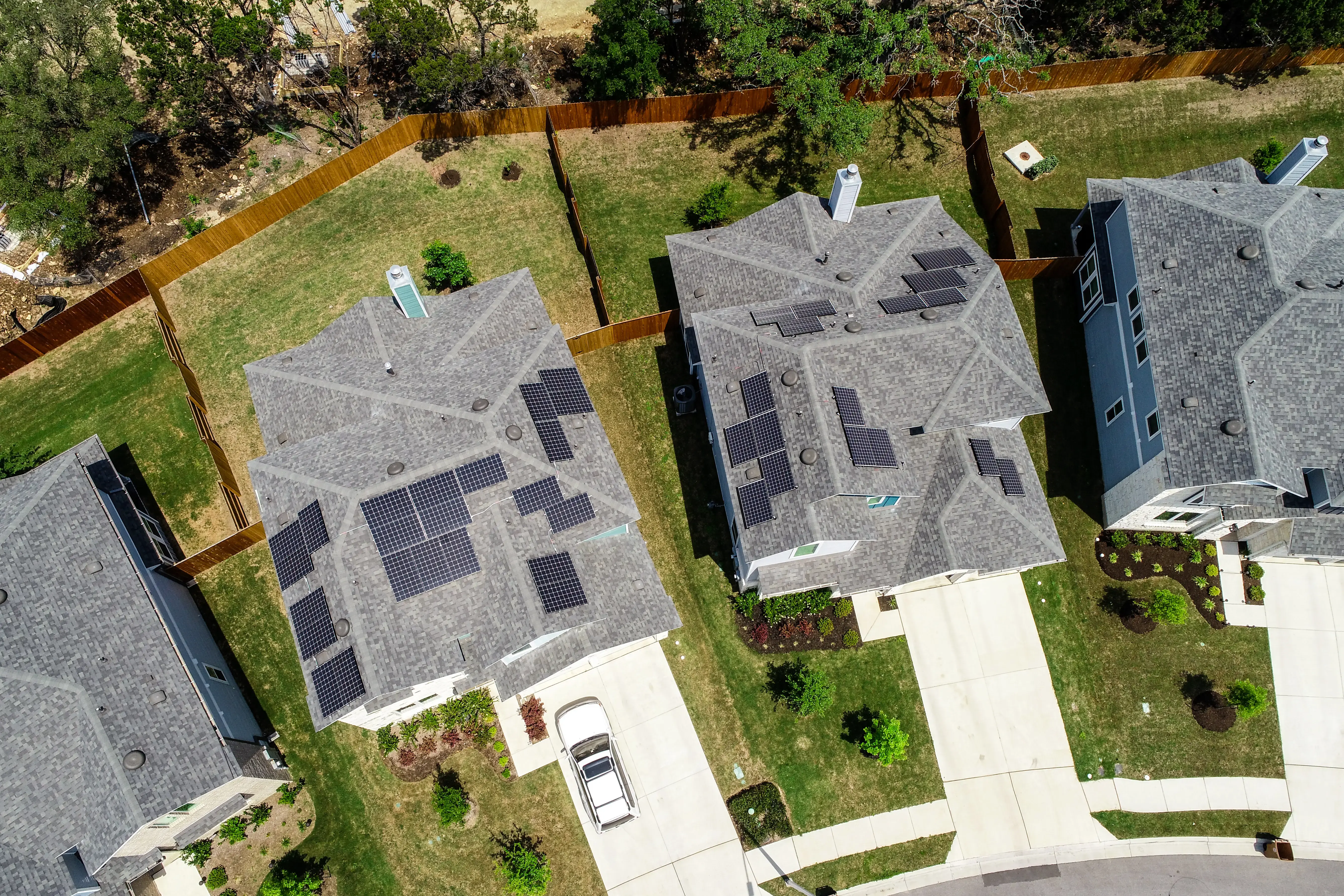 solar panel homes at New urban Suburb development North Austin homes and grey modern rooftops