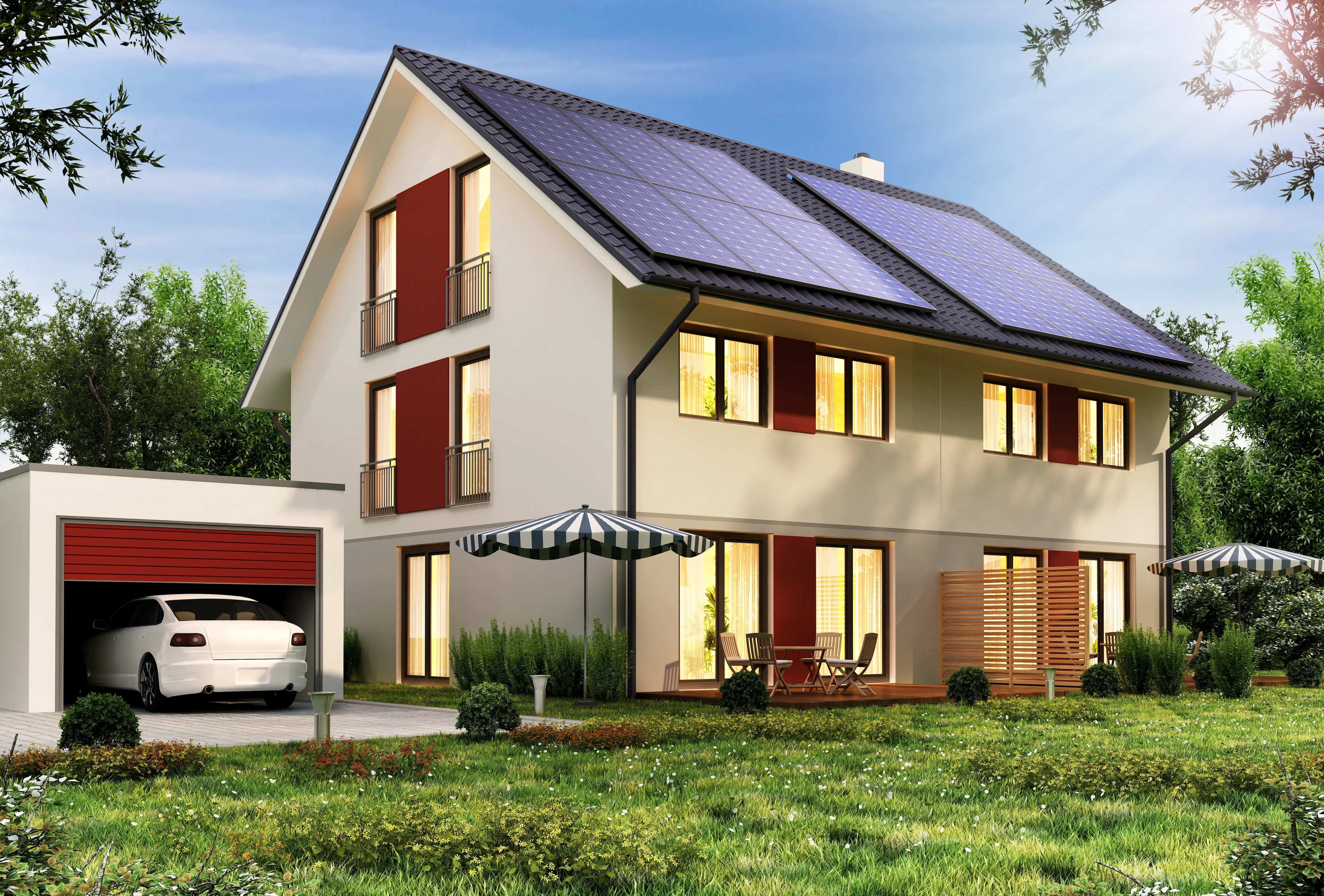 Solar panels on the roof of a modern house with a garage and a car