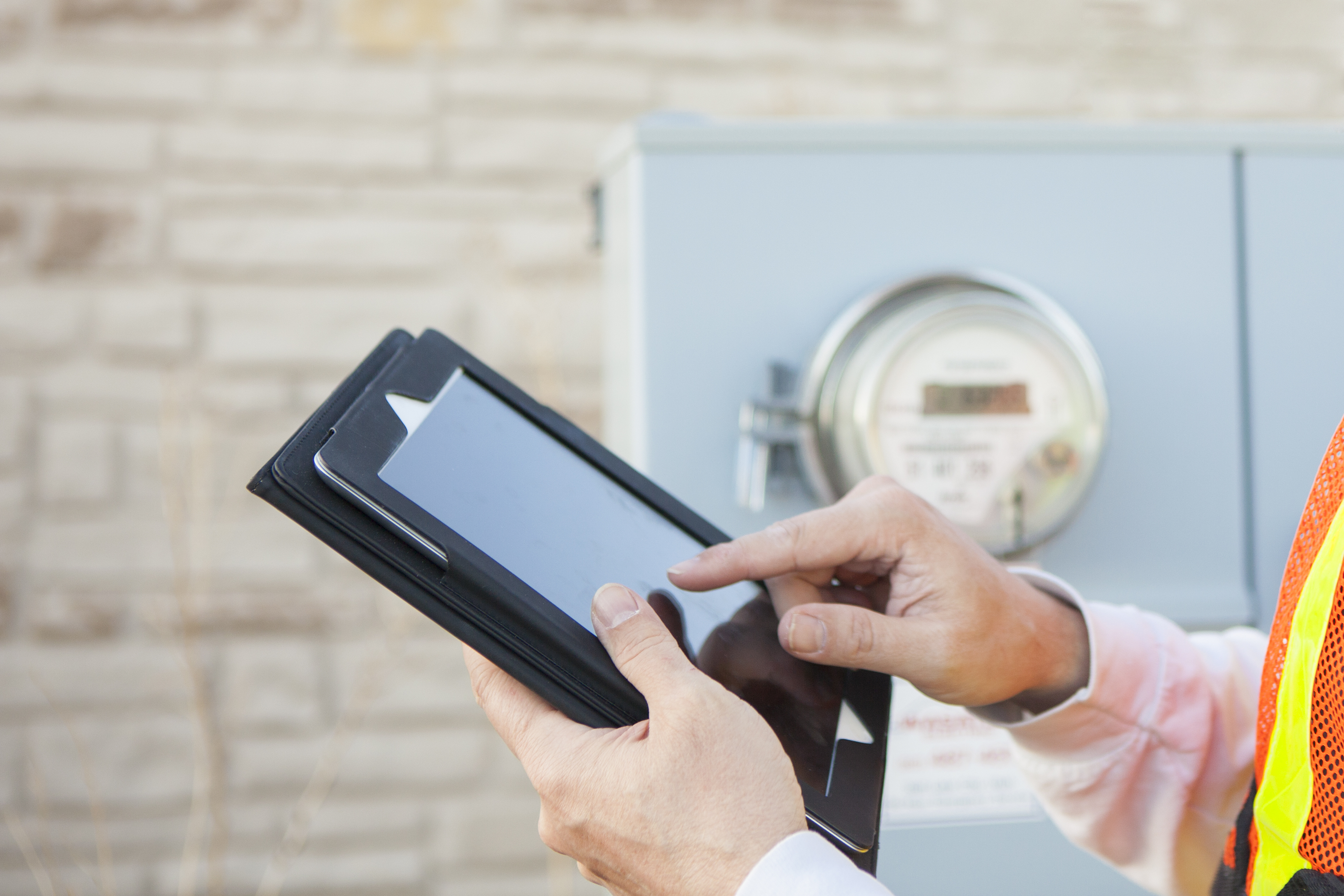 Tablet Computer being used to Collect Electricity Meter Information